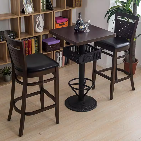 Set of 2 vintage wooden bar stools with black leather cushions and backrests, featuring perforated back designs, ideal for modern bar settings.