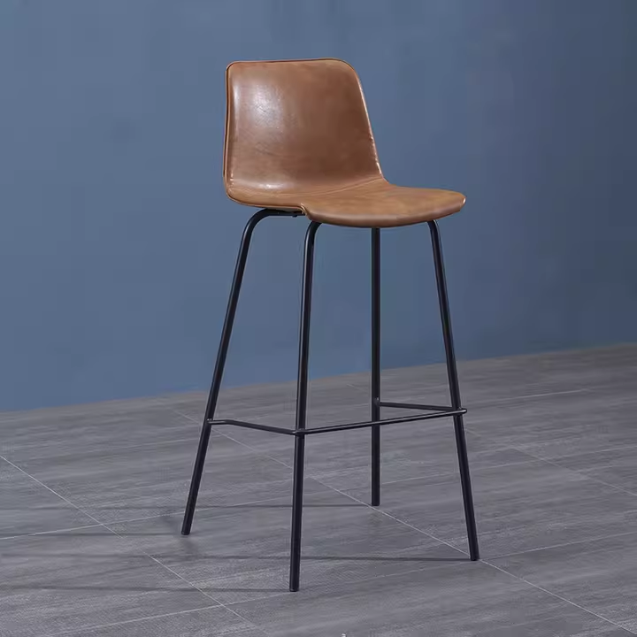 Brown leather bar stool with metal legs, modern design, perfect for stylish interiors.