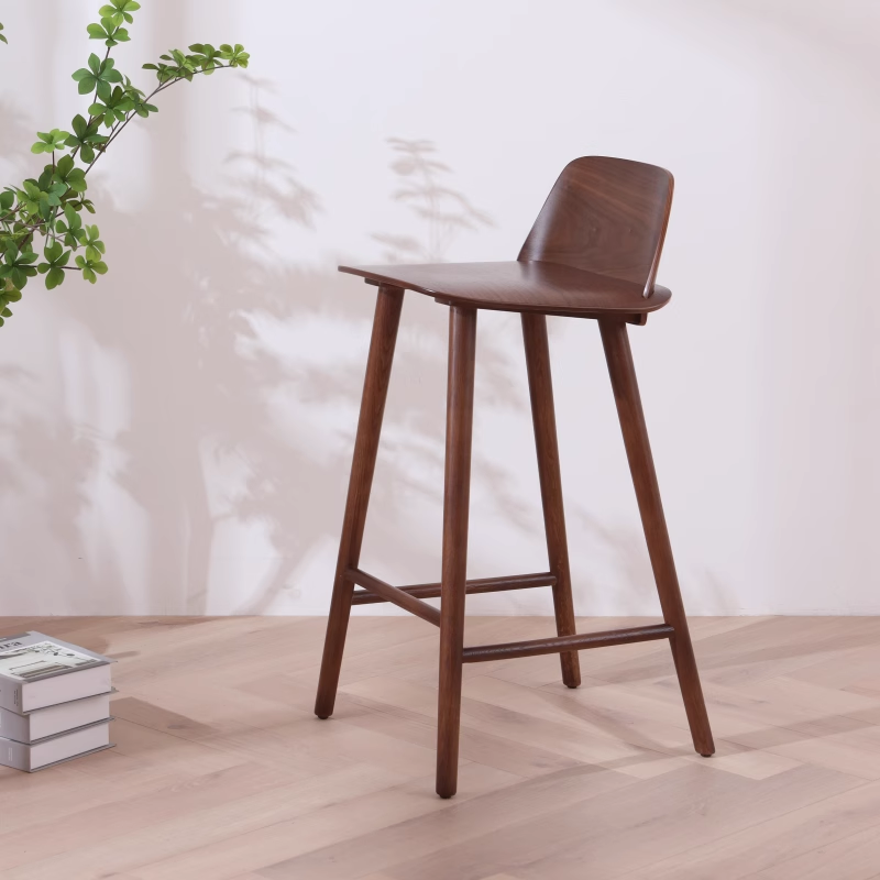 Side view of walnut wood barstool with modern design and ergonomic backrest.