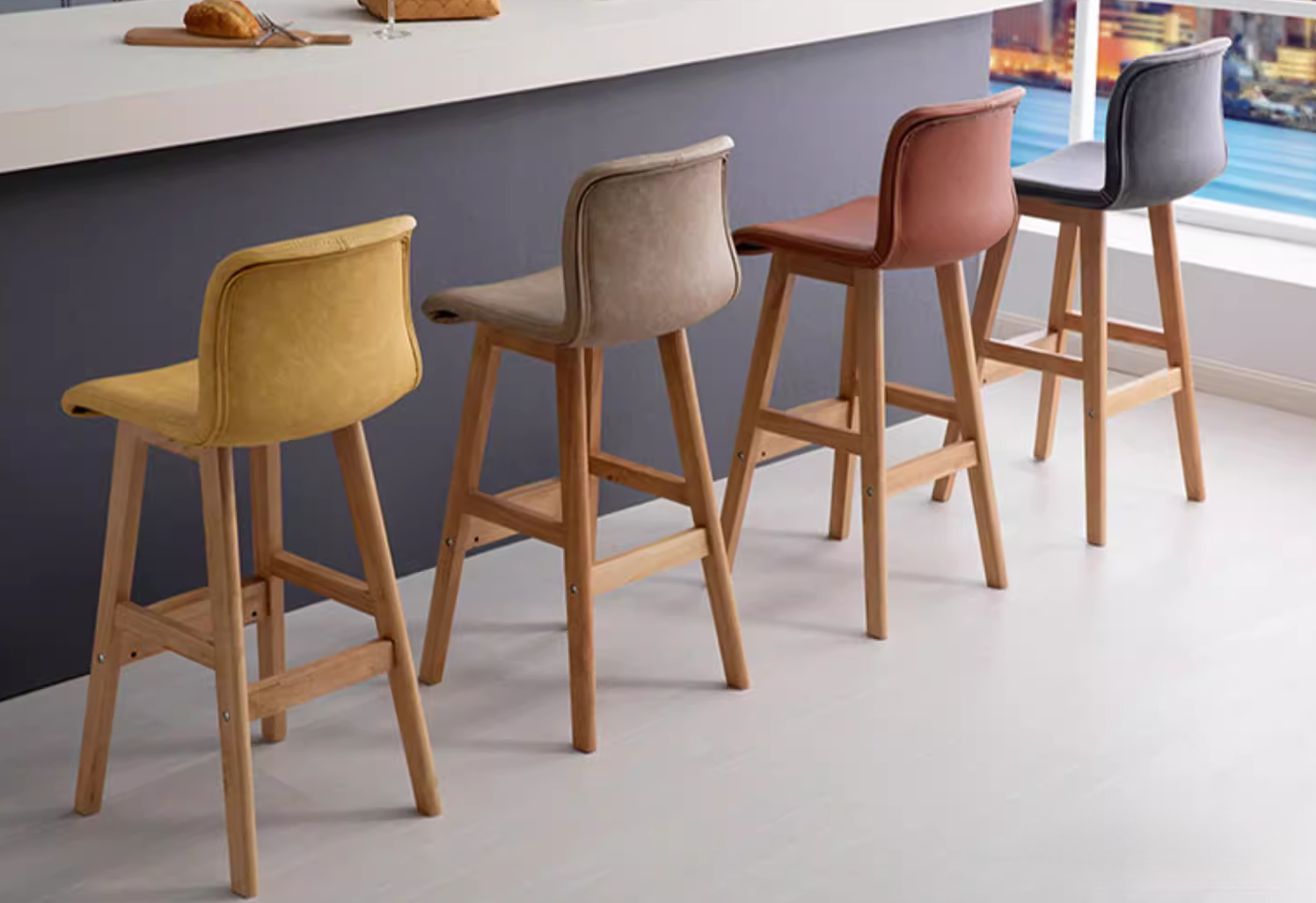 Wooden bar stool with black leather seat and backrest, designed for kitchen and dining use, showcasing a modern, simple design with four wooden legs.