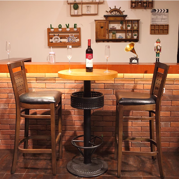 Wooden barstool set with black cushioned seats, a wine bottle and glasses on a round wooden table.