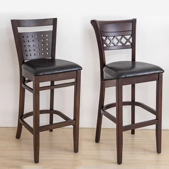 Two wooden barstools with punched-back design and diamond pattern, featuring black cushioned seats.