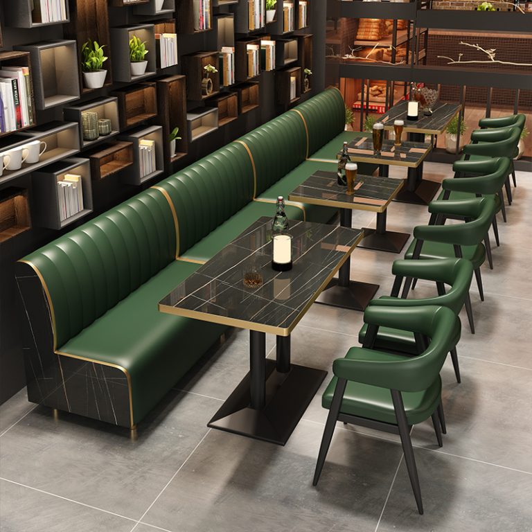 Green cushioned booth seats, rock dining tables, dining chairs