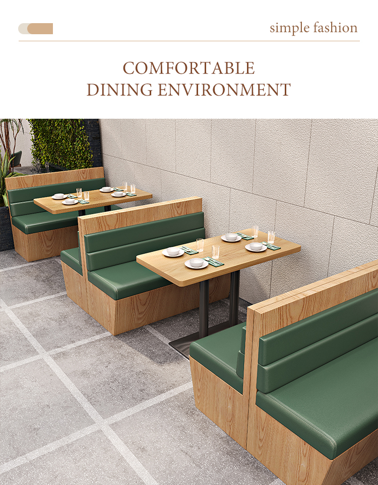 Stylish restaurant booth seating with wooden frames and green cushions, paired with wooden dining tables for a cozy and elegant dining atmosphere