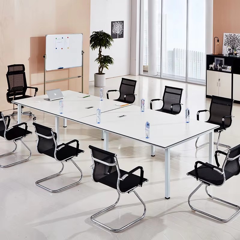 White conference table and office chairs