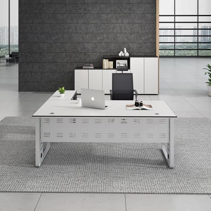 a white, minimalist desk with metallic legs