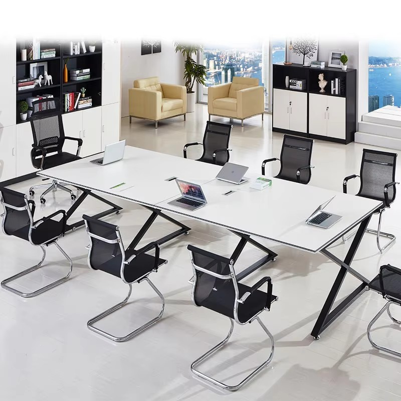 Contemporary meeting space featuring a white meeting table, ergonomic office chairs, laptops, a storage cabinet with decor, and panoramic city viewsContemporary meeting space featuring a white meeting table, ergonomic office chairs, laptops, a storage cabinet with decor, and panoramic city views