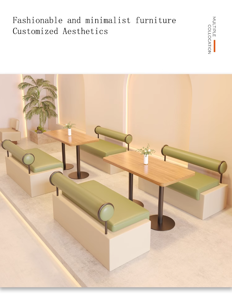 A modern dining area featuring minimalist booth seating with green upholstered cushions and cylindrical backrests