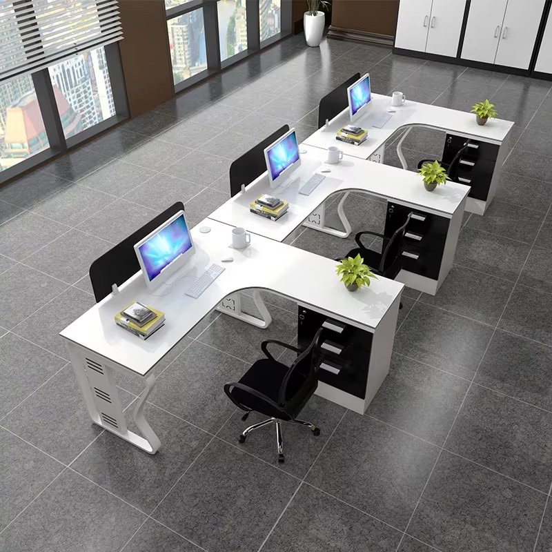 "Spacious office environment equipped with L - shaped workstations