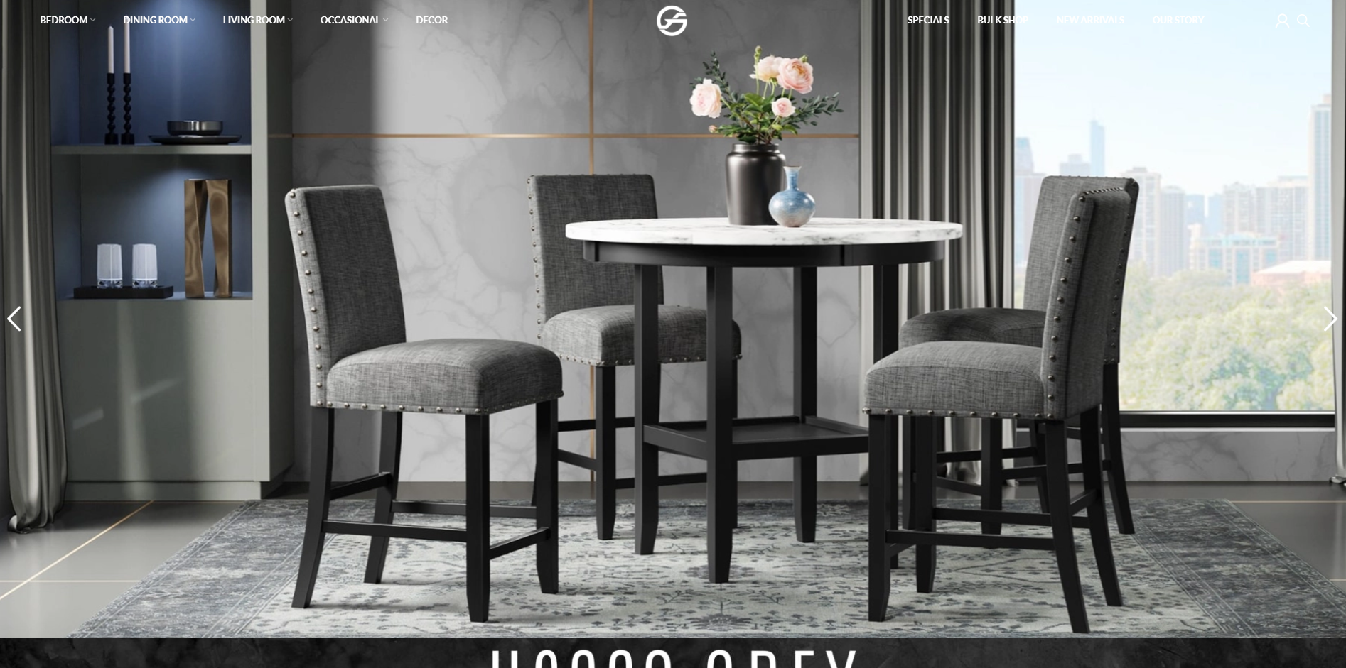 Modern grey upholstered dining set with a round marble table and four nailhead trim chairs, styled for contemporary dining rooms