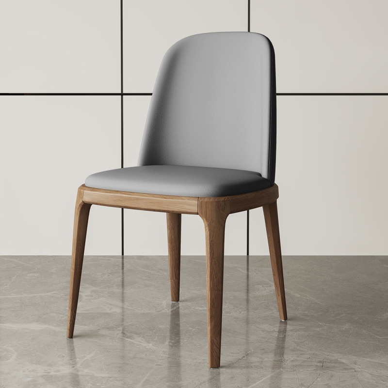 Grey upholstered dining chair with a walnut wood frame, designed for contemporary dining areas.