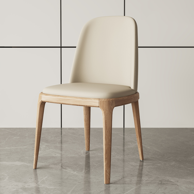 Modern dining chair with beige leather upholstery and natural wooden legs, ideal for elegant dining spaces.