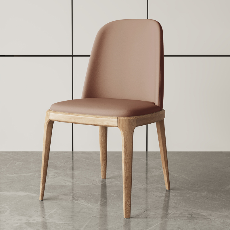 Modern dining chair with beige leather upholstery and natural wooden legs, ideal for elegant dining spaces.