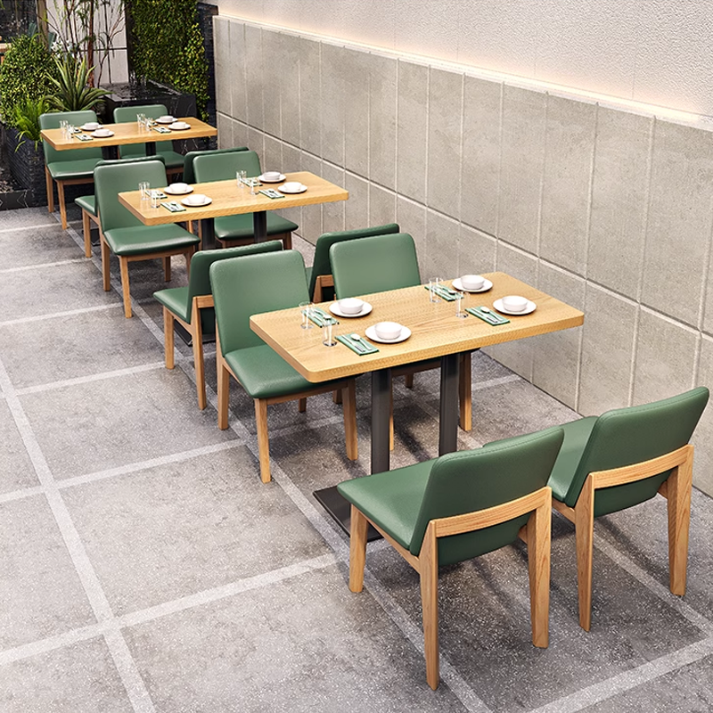 Green Upholstered Dining Chair with Wooden Legs in Outdoor Dining Setting