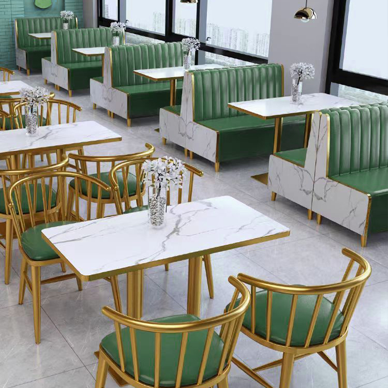 Rectangular restaurant table with a marble top and gold metallic base.