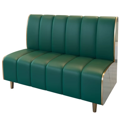 Standalone green upholstered booth seating with gold accents.