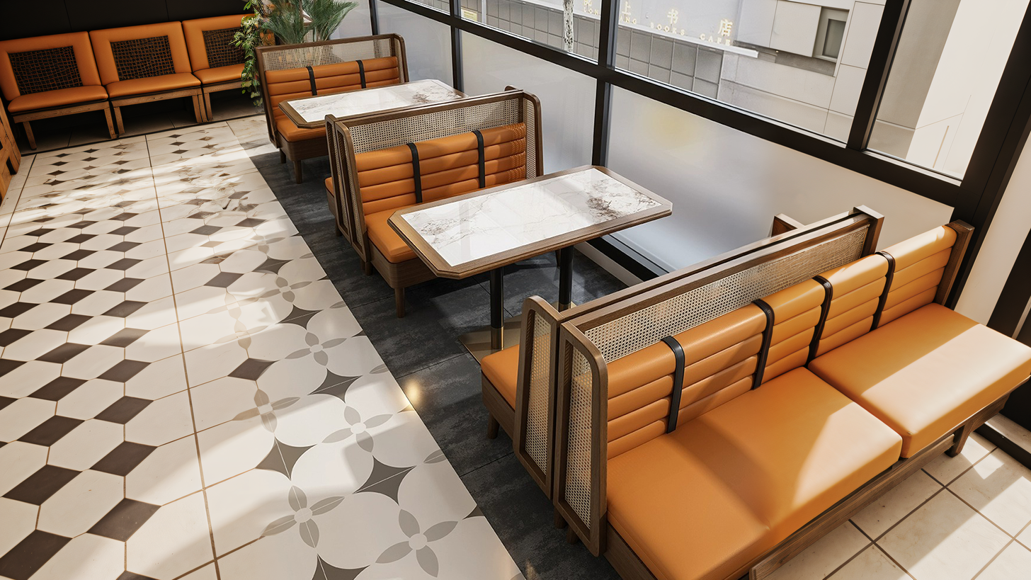 Luxury wooden booth seating with orange cushions and marble dining tables in a modern restaurant.