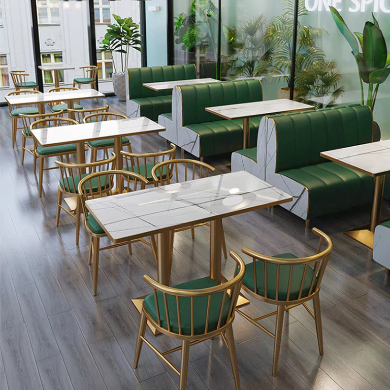 Rectangular restaurant table with a marble top and gold metallic base.