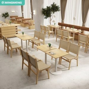 Modern restaurant furniture set featuring wooden chairs with cane and woven backs, cushioned benches, and light wood tables, creating a cozy and stylish dining environment.