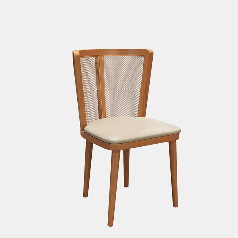 Light wooden dining chair with a cane backrest and cream-colored cushioned seat.