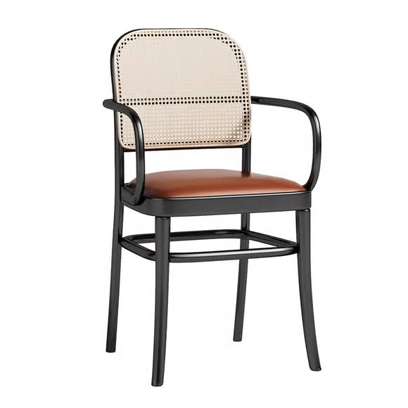 black metal cane armchair with brown leather seat, industrial design, stylish seating solution