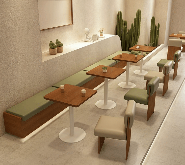 A modern café interior showcasing wooden tables and cushioned chairs in a comfortable, sleek arrangement.