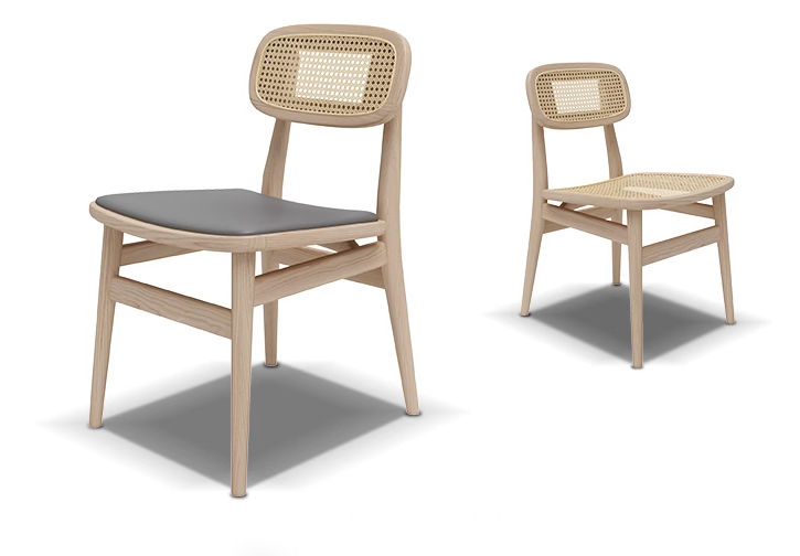 Two cane back dining chairs shown in light wood finish, one with a gray cushioned seat and the other with a cane woven seat.