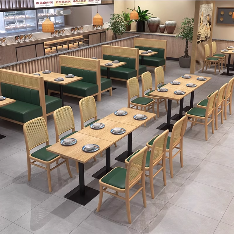 Dining area with cushioned benches and wooden tables in a modern restaurant design.