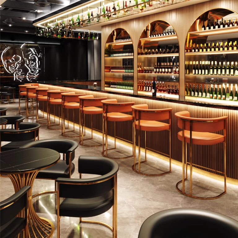 Modern bar interior featuring orange bar stools and shelves filled with wine bottles, creating a warm and inviting atmosphere.