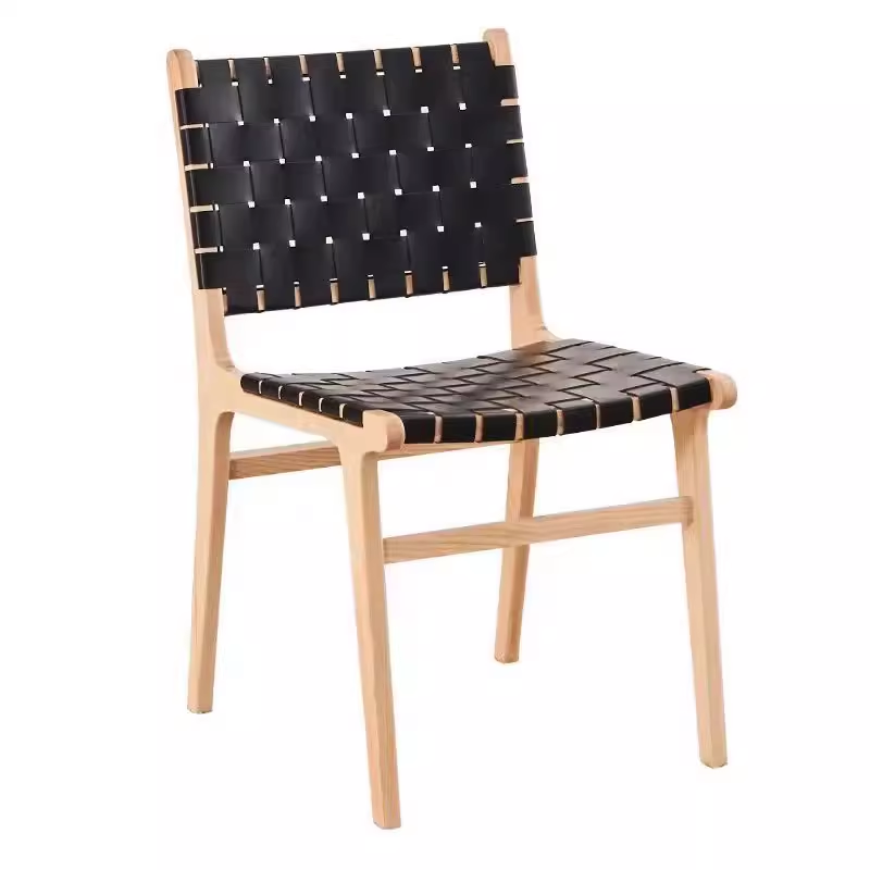 Black woven leather chair with a wooden frame, modern design for dining spaces