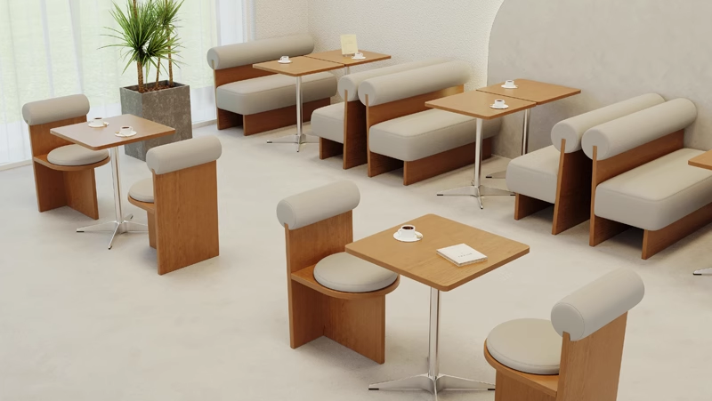 A stylish cafe interior featuring tables with cushioned seats and contemporary decor elements.