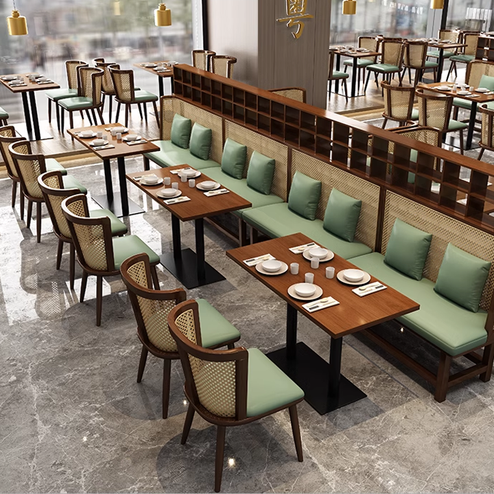 Stylish restaurant seating with wooden cane chairs, tables, and modern decor.