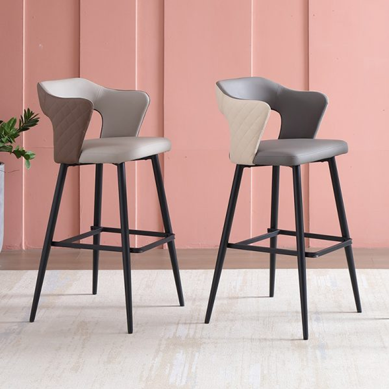 Two-tone modern leather barstools with black metal legs and quilted backrest design.