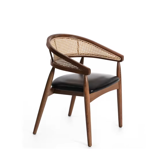 Modern wooden cane chair with cushioned seat, featuring a curved backrest and natural wood frame in light ash color.