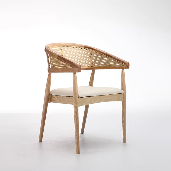 Modern wooden cane chair with light beige cushioned seat and light ash wood frame, featuring a curved backrest.