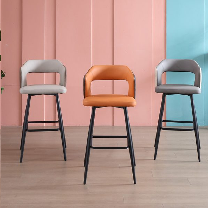 Three multi-color leather barstools with black metal frames, showcasing orange, gray, and beige designs.