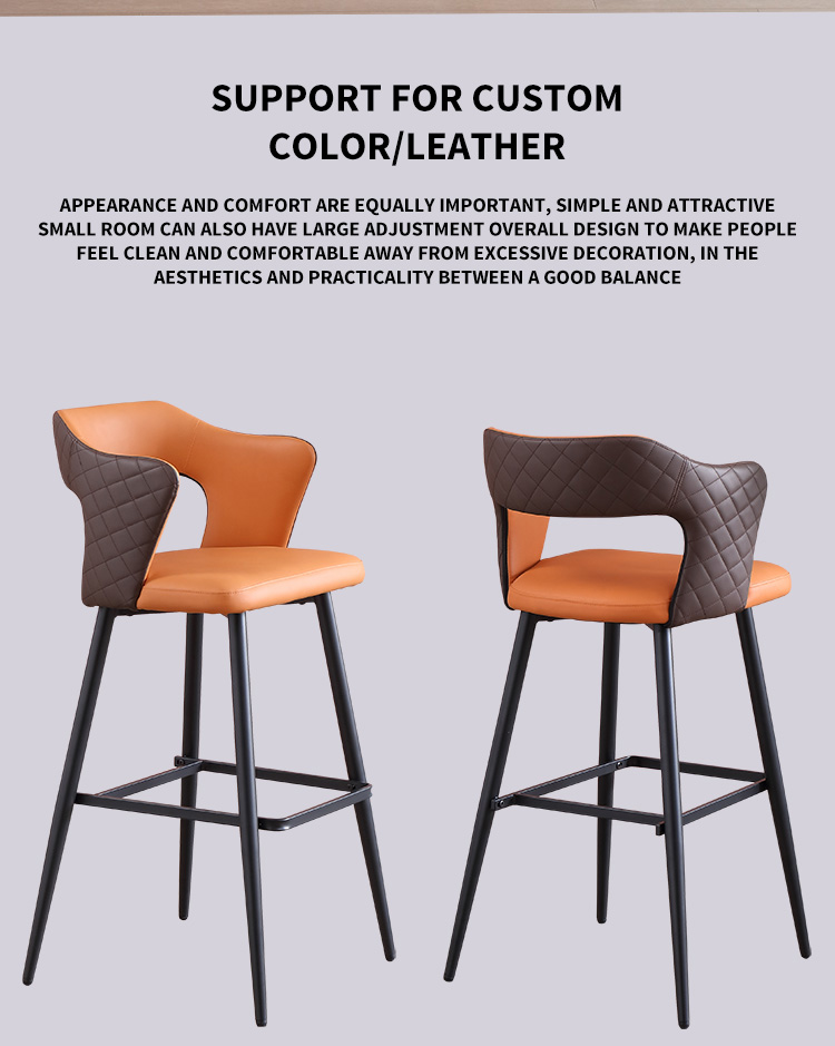 Pair of orange and gray leather barstools with black metal frames and quilted backrests.