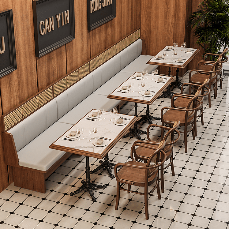 Wooden restaurant furniture featuring cane-backed chairs with armrests and a classic design, perfect for dining spaces